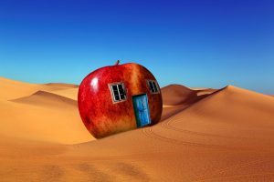 Shifting sand, apple house in the desert