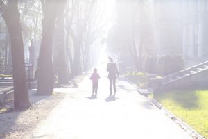 Parent and child walking. Daily devotional